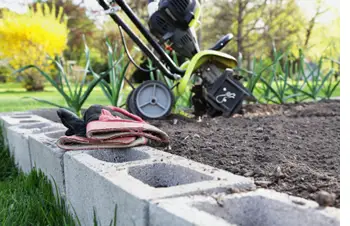 raised garden bed with concrete block frame